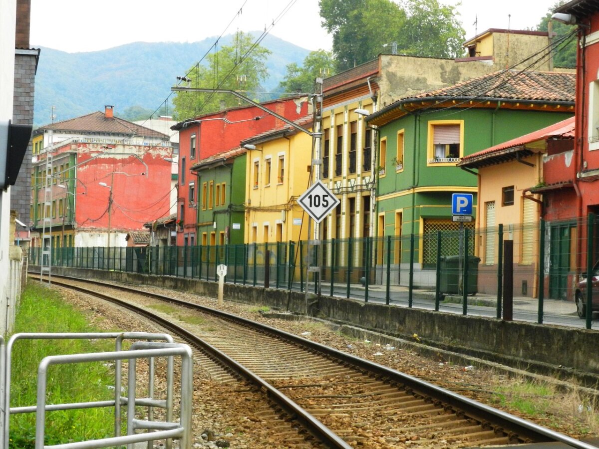 Colourful houses facing Langreo's railway